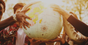 people holding a globe